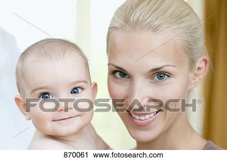 A woman and her baby View Large Photo Image Stock Image - A woman and her baby . Fotosearch