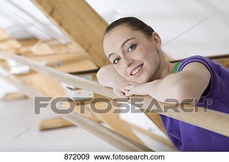 A ballet dancer resting her head on her arms at the barre in a ballet studio View Large Photo Image Stock Photo - A ballet dancer resting her head on her arms at the barre in a ballet studio. Fotosearch