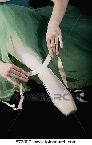 The hands of ballet dancer tying a pointe shoe View Large Photo Image Stock Photo - The hands of ballet dancer tying a pointe shoe. Fotosearch