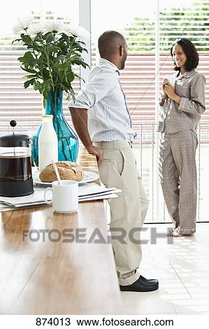 A young couple relaxing in the morning View Large Photo Image Stock Image - A young couple relaxing in the morning. Fotosearch