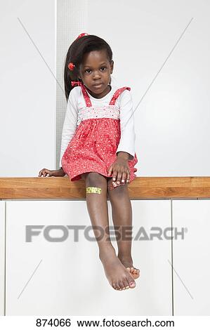 A young girl with a bandage on each knee View Large Photo Image Stock Photograph - A young girl with a bandage on each knee. Fotosearch