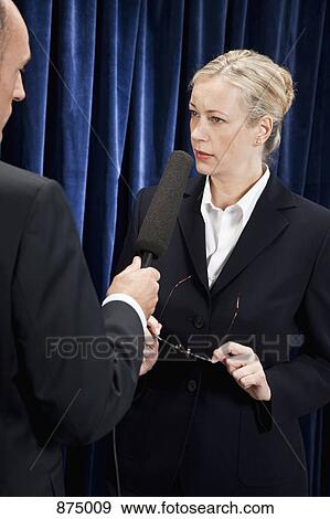 A woman in a suit being interviewed View Large Photo Image Stock Photo - A woman in a suit being interviewed. Fotosearch