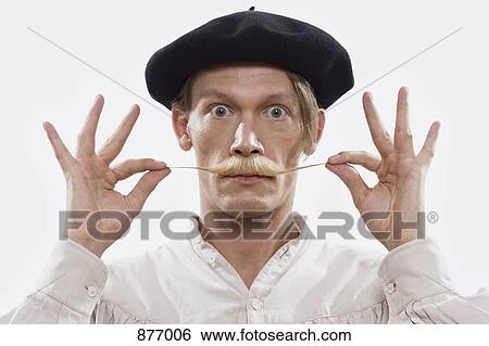 A costumed man twisting his mustache, portrait View Large Photo Image Stock Photograph - A costumed man twisting his mustache, portrait. Fotosearch