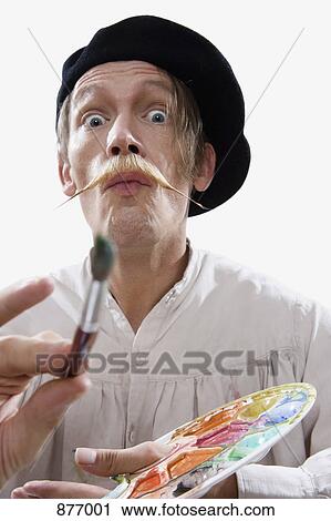 Stock Image - A man dressed like a stereotypical painter. Fotosearch