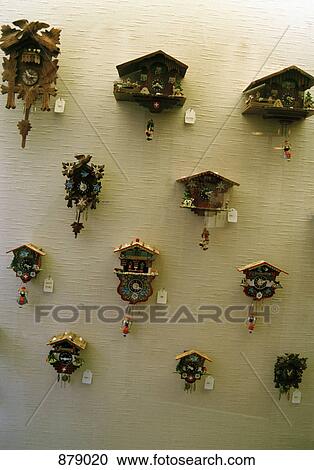 Stock Image - Cuckoo clocks on a wall. Fotosearch