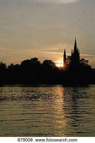 Silhouette of a church on a lake View Large Photo Image Stock Photo - Silhouette of a church on a lake. Fotosearch