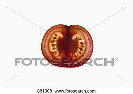 A slice of an organic tomato on a lightbox View Large Photo Image Stock Photo - A slice of an organic tomato on a lightbox. Fotosearch