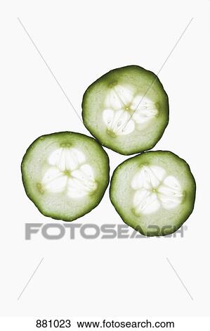 Three slices of an organic cucumber on a lightbox View Large Photo Image Stock Image - Three slices of an organic cucumber on a lightbox. Fotosearch
