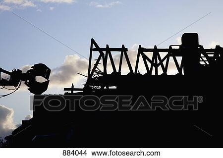 Silhouette of a building being demolished View Large Photo Image Picture - Silhouette of a building being demolished. Fotosearch