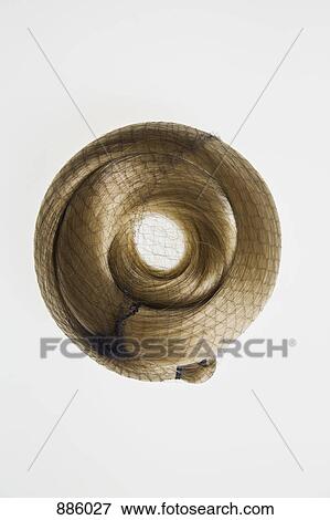 A blonde hair piece curled up in a net View Large Photo Image Stock Photo - A blonde hair piece curled up in a net. Fotosearch