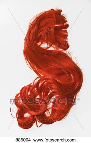 A red hair piece View Large Photo Image Picture - A red hair piece. Fotosearch
