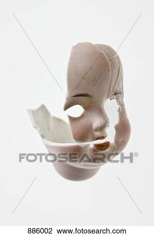 Stock Image - Pieces of the head of a doll. Fotosearch