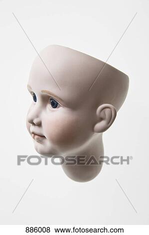 Stock Photo - Side view of the head of a doll. Fotosearch