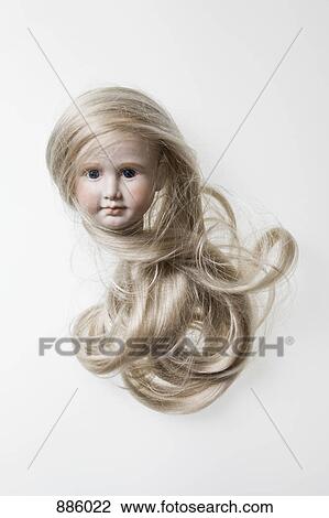 The head of a porcelain doll with long blond hair View Large Photo Image Stock Image - The head of a porcelain doll with long blond hair. Fotosearch