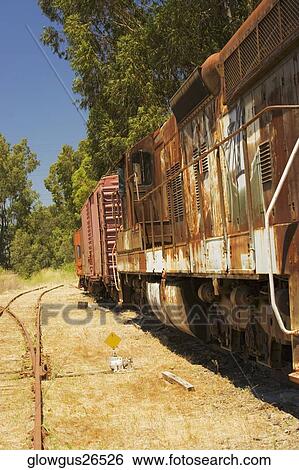 Abandoned freight train on railroad track View Large Photo Image Stock Photograph - Abandoned freight train on railroad track. Fotosearch