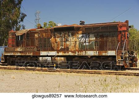 Stock Photo - Abandoned train engine on railroad track. Fotosearch