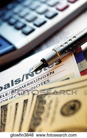 Appointment book, calculator, pen and US one hundred dollar bills, close-up View Large Photo Image Stock Photo - Appointment book, calculator, pen and US one hundred dollar bills, close-up. Fotosearch