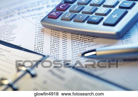Appointment book, calculator, pen financial data, close-up View Large Photo Image Stock Photo - Appointment book, calculator, pen financial data, close-up. Fotosearch