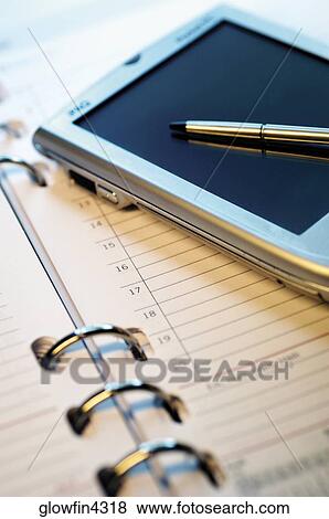 Appointment book, PDA and pen, close-up View Large Photo Image Stock Photo - Appointment book, PDA and pen, close-up. Fotosearch