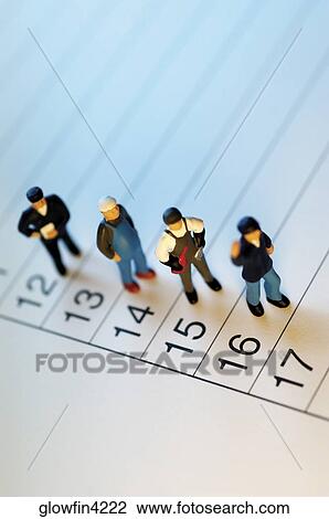 Appointment book with toy men standing on it View Large Photo Image Stock Image - Appointment book with toy men standing on it. Fotosearch