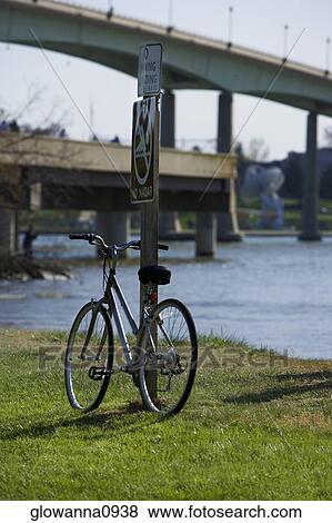 Stock Photo - Bicycle leaning against a pole, Annapolis, Maryland, USA. Fotosearch