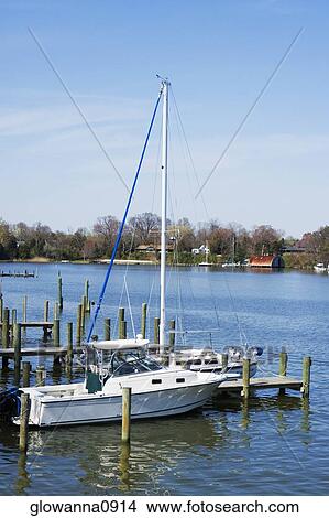 Boat docked at a pier View Large Photo Image Picture - Boat docked at a pier. Fotosearch