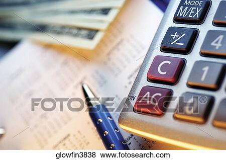 Calculator, calendar, pen and US one hundred dollar bills, close-up View Large Photo Image Stock Photo - Calculator, calendar, pen and US one hundred dollar bills, close-up. Fotosearch