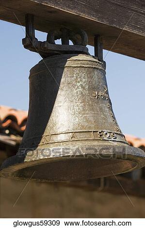 Close-up of a bell hanging in front of a house View Large Photo Image Stock Photo - Close-up of a bell hanging in front of a house. Fotosearch
