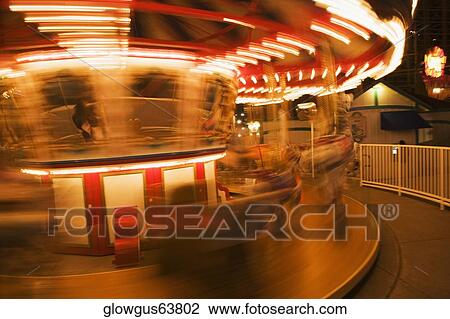 Close-up of a carousel at night View Large Photo Image Stock Image - Close-up of a carousel at night. Fotosearch