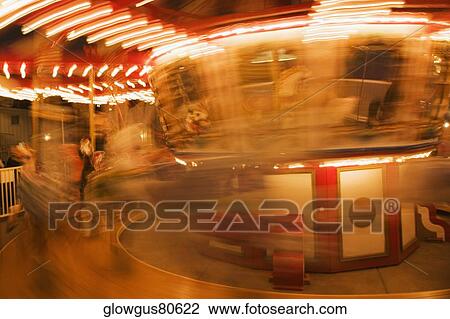 Close-up of a carousel at night View Large Photo Image Stock Image - Close-up of a carousel at night. Fotosearch
