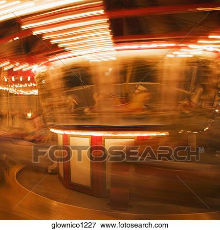 Stock Photo - Close-up of a carousel at night. Fotosearch