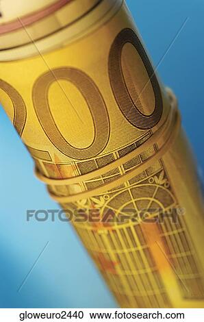 Stock Image - Close-up of a roll of Euro banknotes. Fotosearch