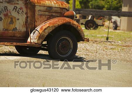 Close-up of an abandoned pick-up truck parked on a field View Large Photo Image Stock Image - Close-up of an abandoned pick-up truck parked on a field. Fotosearch