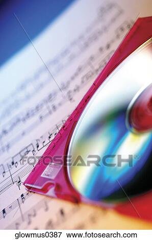 Stock Photo - Close-up of CD and sheet music. Fotosearch