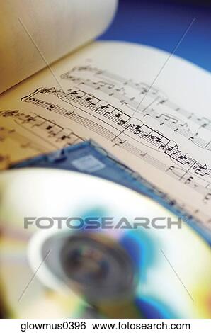 Close-up of CD and sheet music View Large Photo Image Stock Photograph - Close-up of CD and sheet music. Fotosearch