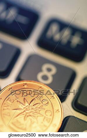 Close-up of Eurocent coin on calculator View Large Photo Image Stock Image - Close-up of Eurocent coin on calculator. Fotosearch