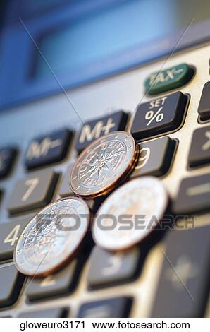 Close-up of Eurocent coins on a calculator View Large Photo Image Stock Image - Close-up of Eurocent coins on a calculator. Fotosearch