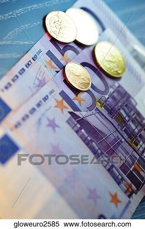 Stock Photography - Close-up of Eurocent coins on Euro banknotes. Fotosearch