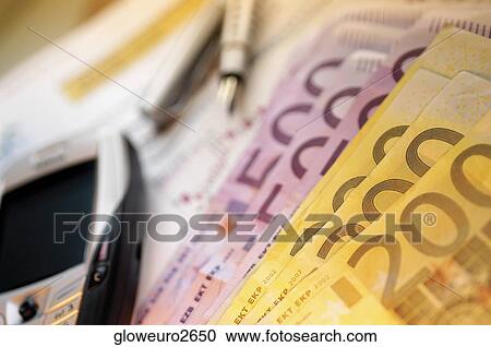Close-up of five hundred and two hundred Euro banknotes near a mobile phone View Large Photo Image Stock Image - Close-up of five hundred and two hundred Euro banknotes near a mobile phone. Fotosearch