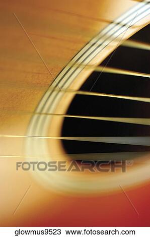 Close-up of guitar and its strings View Large Photo Image Stock Image - Close-up of guitar and its strings. Fotosearch