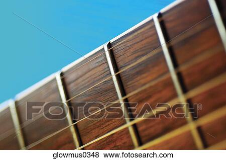 Close-up of guitar frets and strings View Large Photo Image Stock Photo - Close-up of guitar frets and strings. Fotosearch