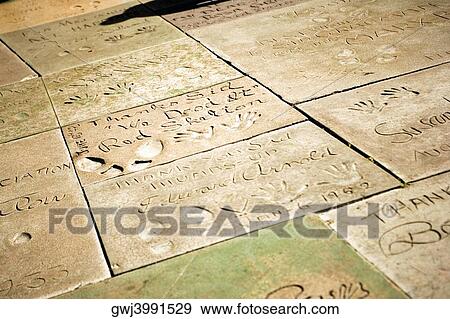 Close-up of hand and footprints at a theater, Mann's Chinese Theater, Los Angeles, California, USA View Large Photo Image Stock Photo - Close-up of hand and footprints at a theater, Mann's Chinese Theater, Los Angeles, California, USA. Fotosearch