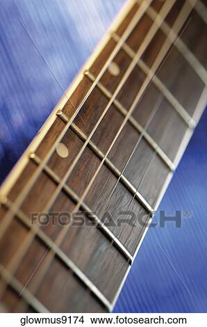 Close-up of handle and strings of electric guitar View Large Photo Image Picture - Close-up of handle and strings of electric guitar. Fotosearch