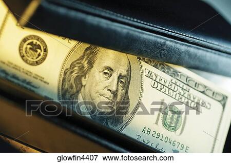 Close-up of one hundred dollar bill inside wallet View Large Photo Image Stock Photo - Close-up of one hundred dollar bill inside wallet. Fotosearch