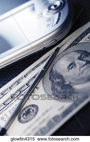 Close-up of PDA, two one hundred dollar bills and pen View Large Photo Image Stock Photography - Close-up of PDA, two one hundred dollar bills and pen. Fotosearch