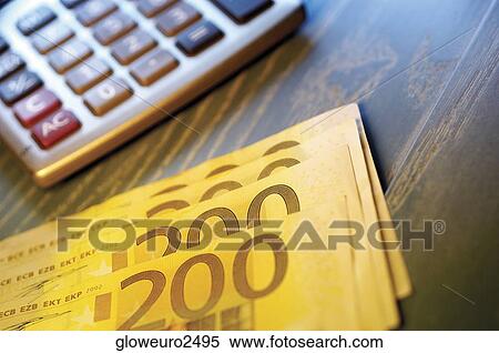Close-up of two hundred Euro banknotes near a calculator View Large Photo Image Stock Photography - Close-up of two hundred Euro banknotes near a calculator. Fotosearch