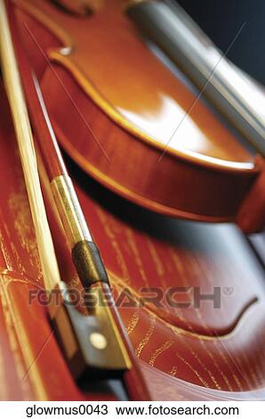 Stock Image - Close-up of violin and violin bow. Fotosearch