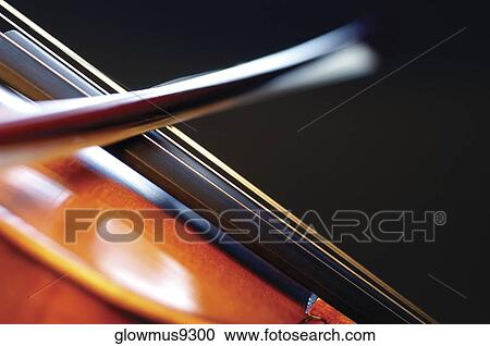 Stock Image - Close-up of violin and violin bow. Fotosearch