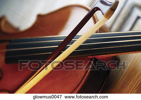 Close-up of violin and violin bow View Large Photo Image Stock Photo - Close-up of violin and violin bow. Fotosearch