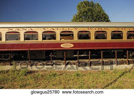 Commuter train on a railroad track View Large Photo Image Stock Image - Commuter train on a railroad track. Fotosearch